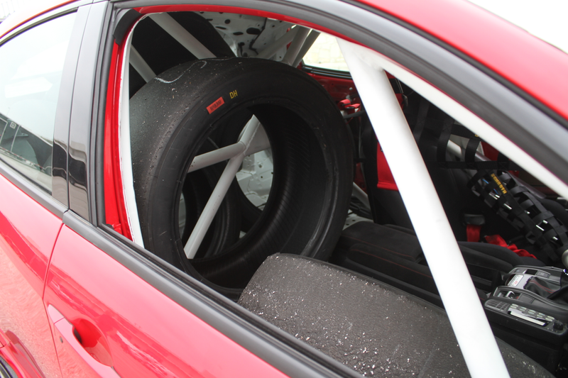 Using all the space they can in the car to leave, as Team HMA had a single-car trailer with only a little extra space for tools and spares.